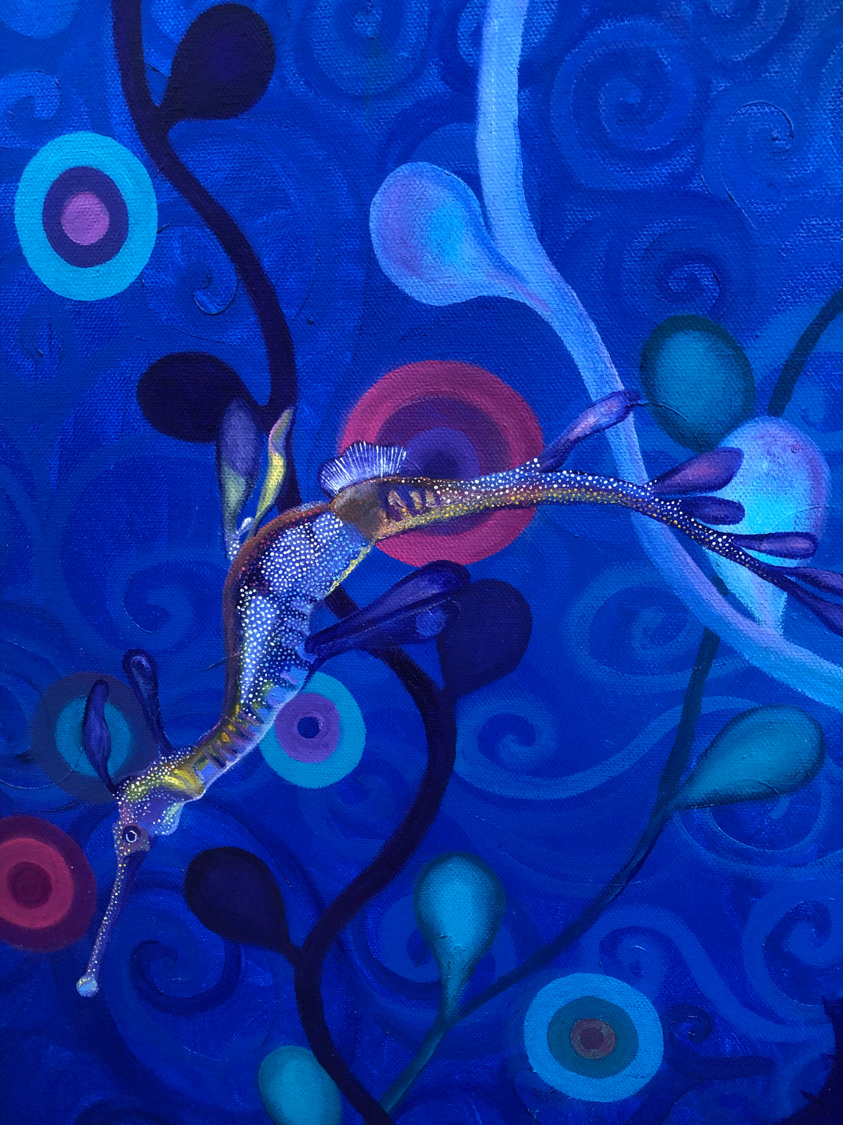 Artistic depiction of a seahorse on a blue patterned background