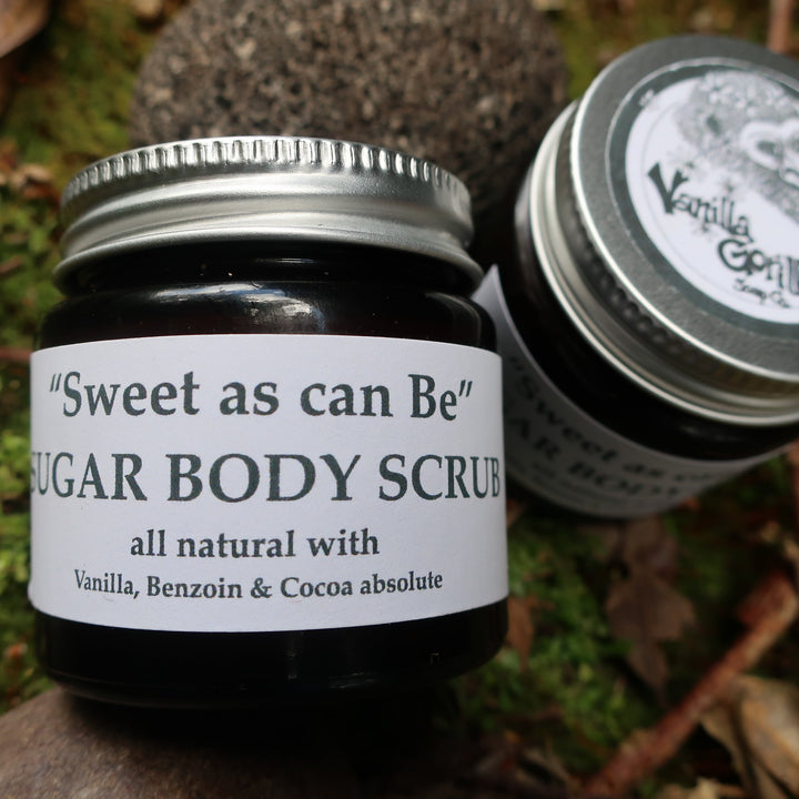Jar of 'Sweet as can be' sugar body scrub with a label on a natural background