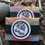 Two colorful love spell soap bars with a vanilla gorilla logo on a natural background