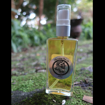 Glass bottle go nourishing face oil with a vanilla gorilla label on a mossy surface