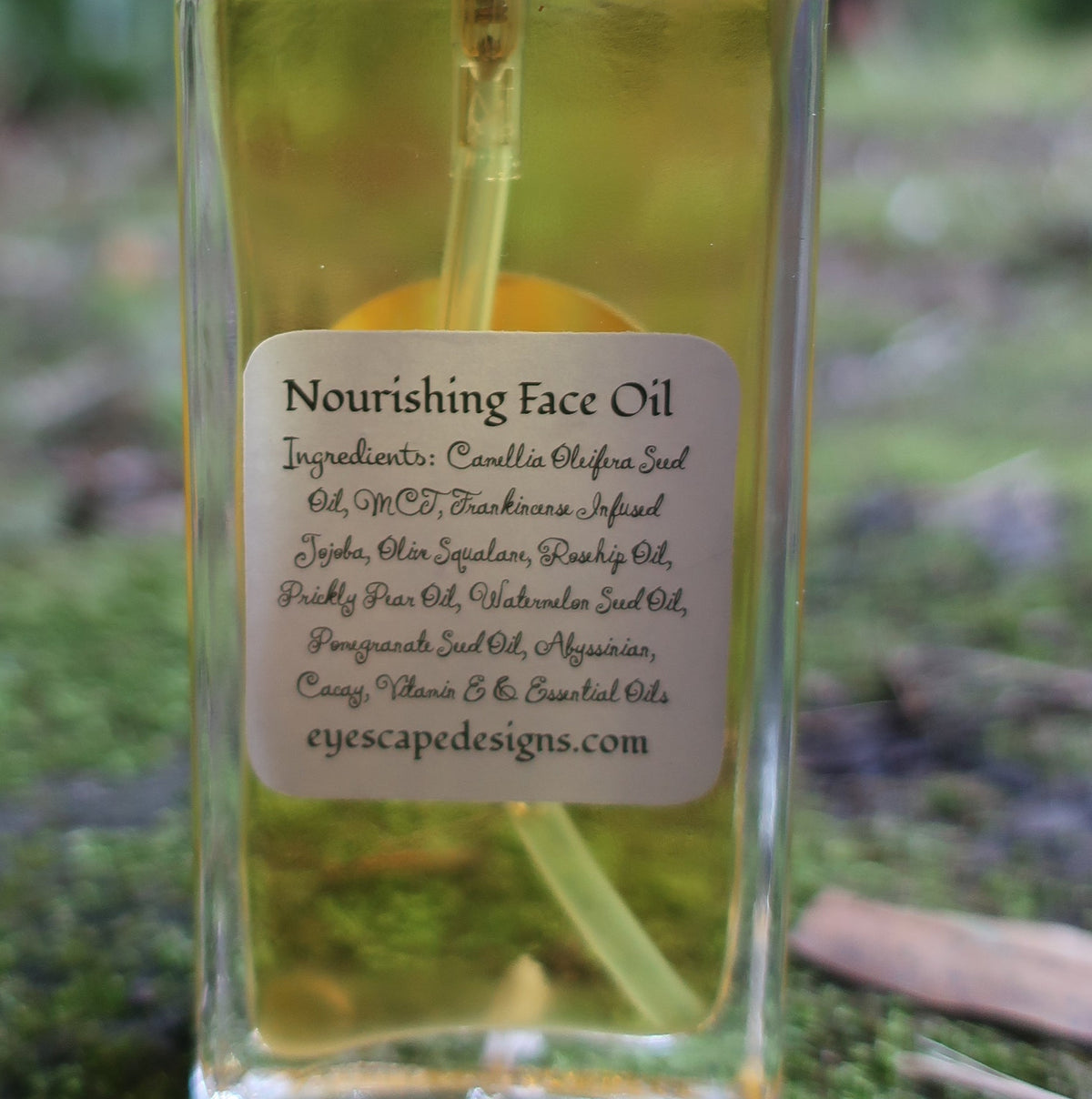 Bottle of 'Nourishing face' oil with an ingredient label on a natural background