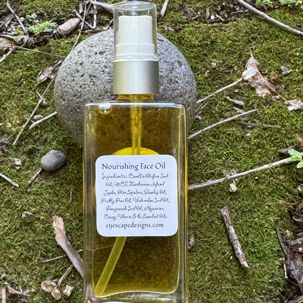 Bottle of nourishing face oil with a label of ingredients on a natural background