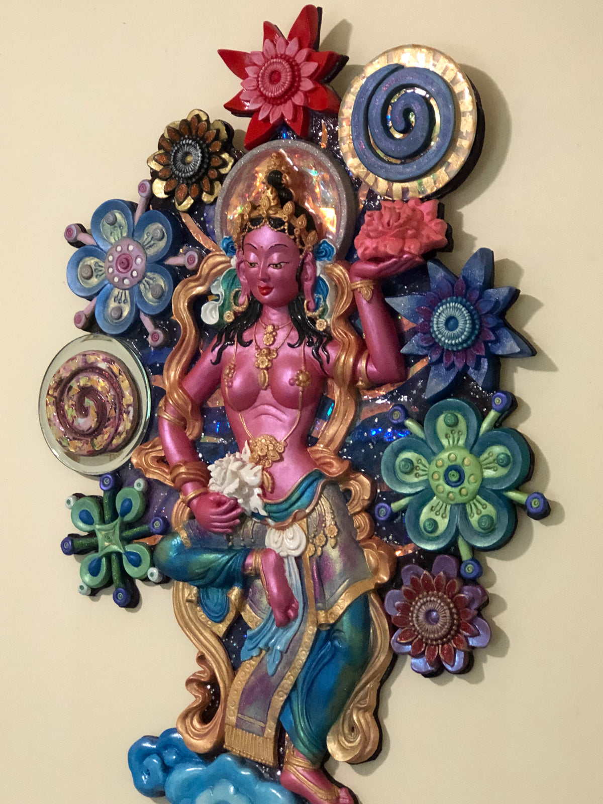 Angled shot of galactic offering goddess in a garden of colourful flowers