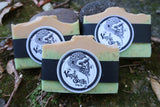 3 green handmade Tahitian lime soap bars with vanilla gorilla label on leafy background