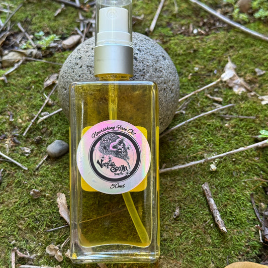 Clear bottle of face oil with a vanilla gorilla label on a natural background