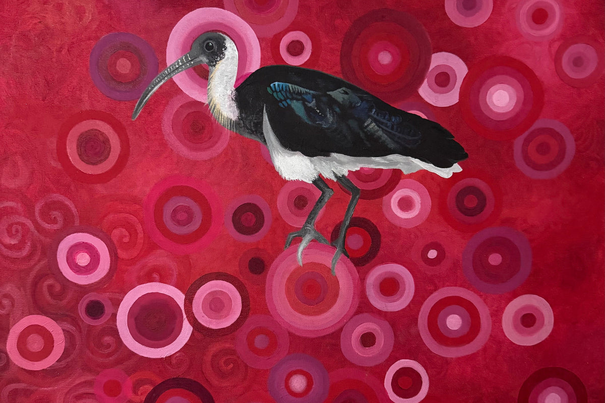 Bird on a red and pink circular patterned background