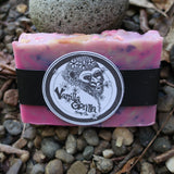 Bar of pink/purple soap with a Vanilla Gorilla label on a stone surface