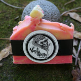 Bar of rosey citrus soap with a vanilla gorilla brand logo on a natural background