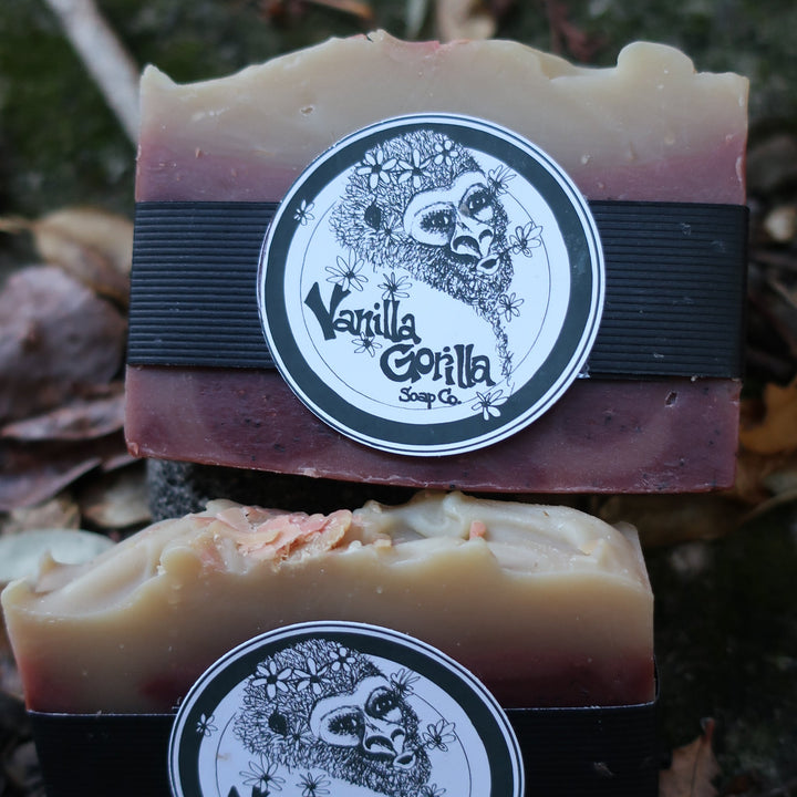 Two bars of strawberry patch soap with 'Vanilla Gorilla' labels on a natural background