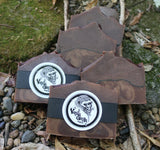 Three bars of Vanilla Gorilla soap on a natural stone surface with greenery.