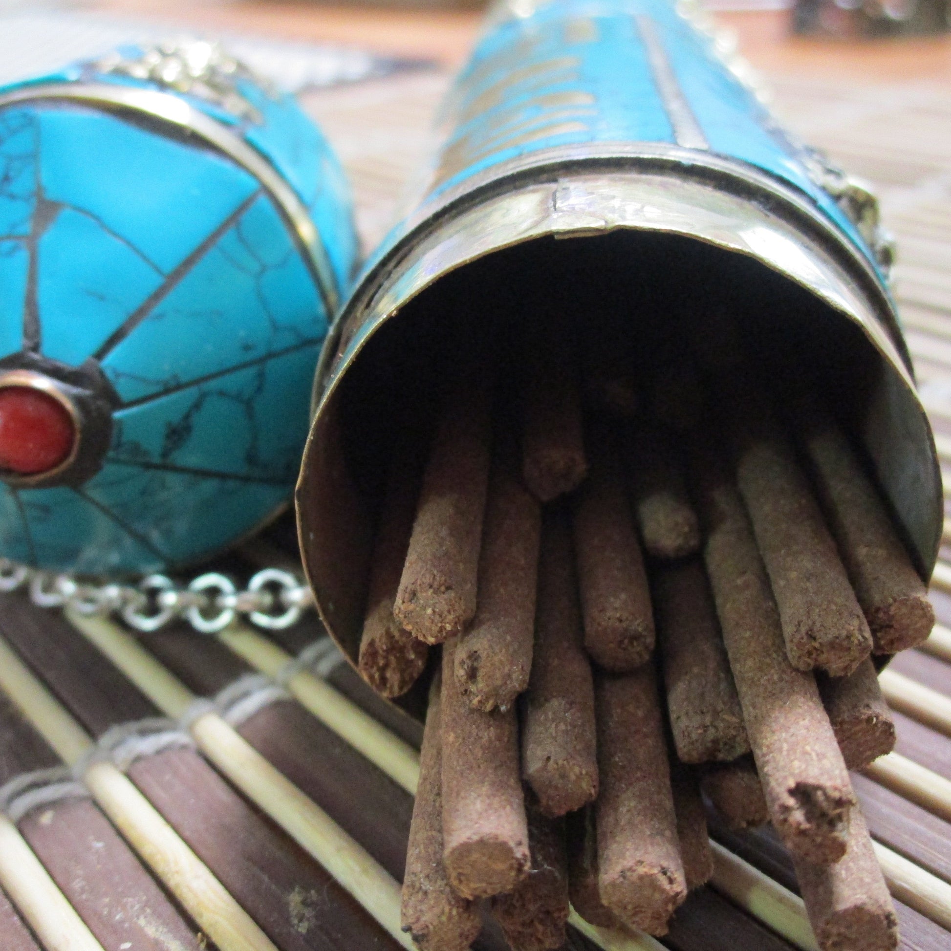 turquoise inlaid incense holder with stick incense
