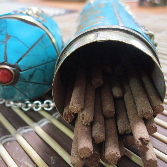 turquoise inlaid incense holder with stick incense
