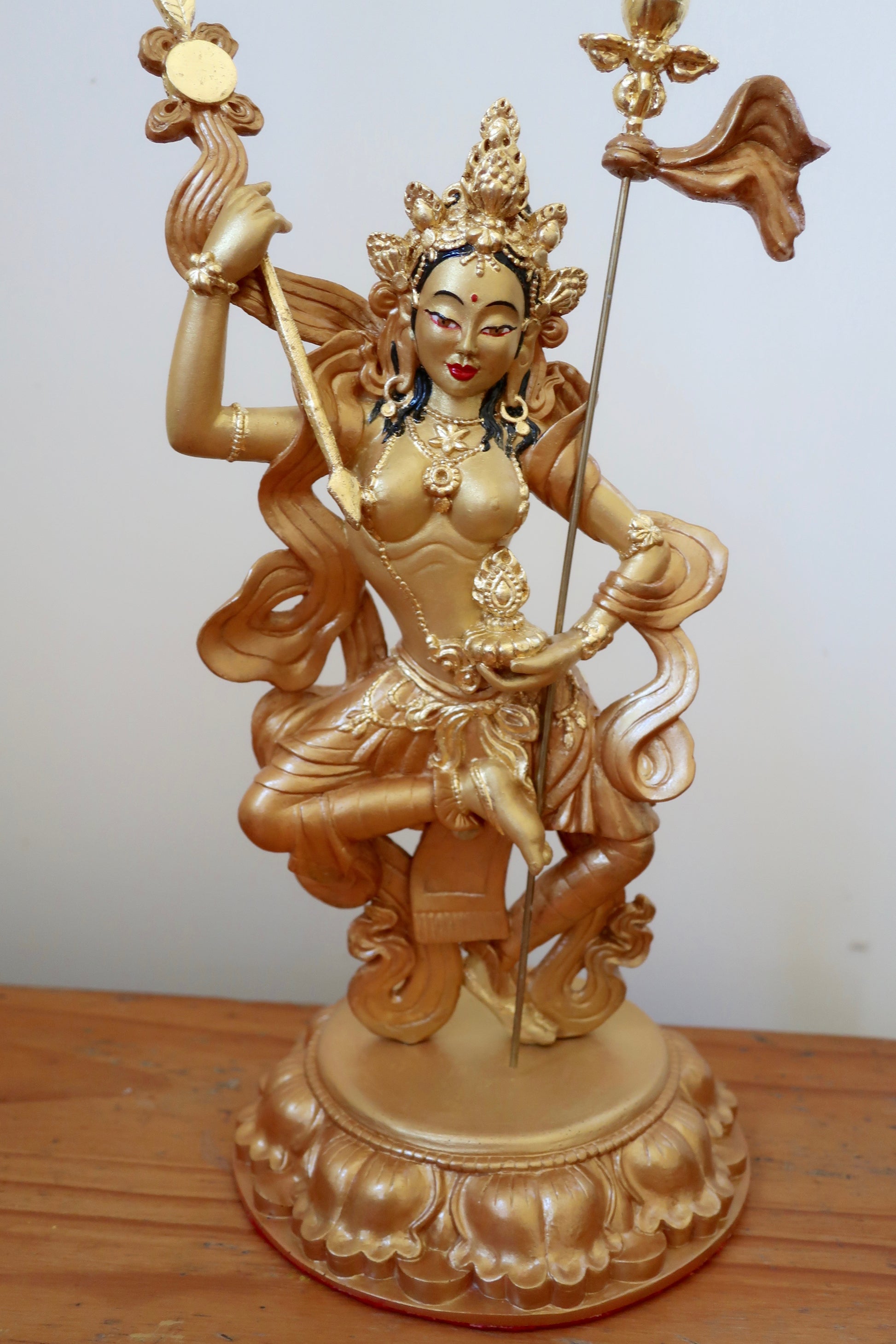 Golden Mandarava Statue on a white background